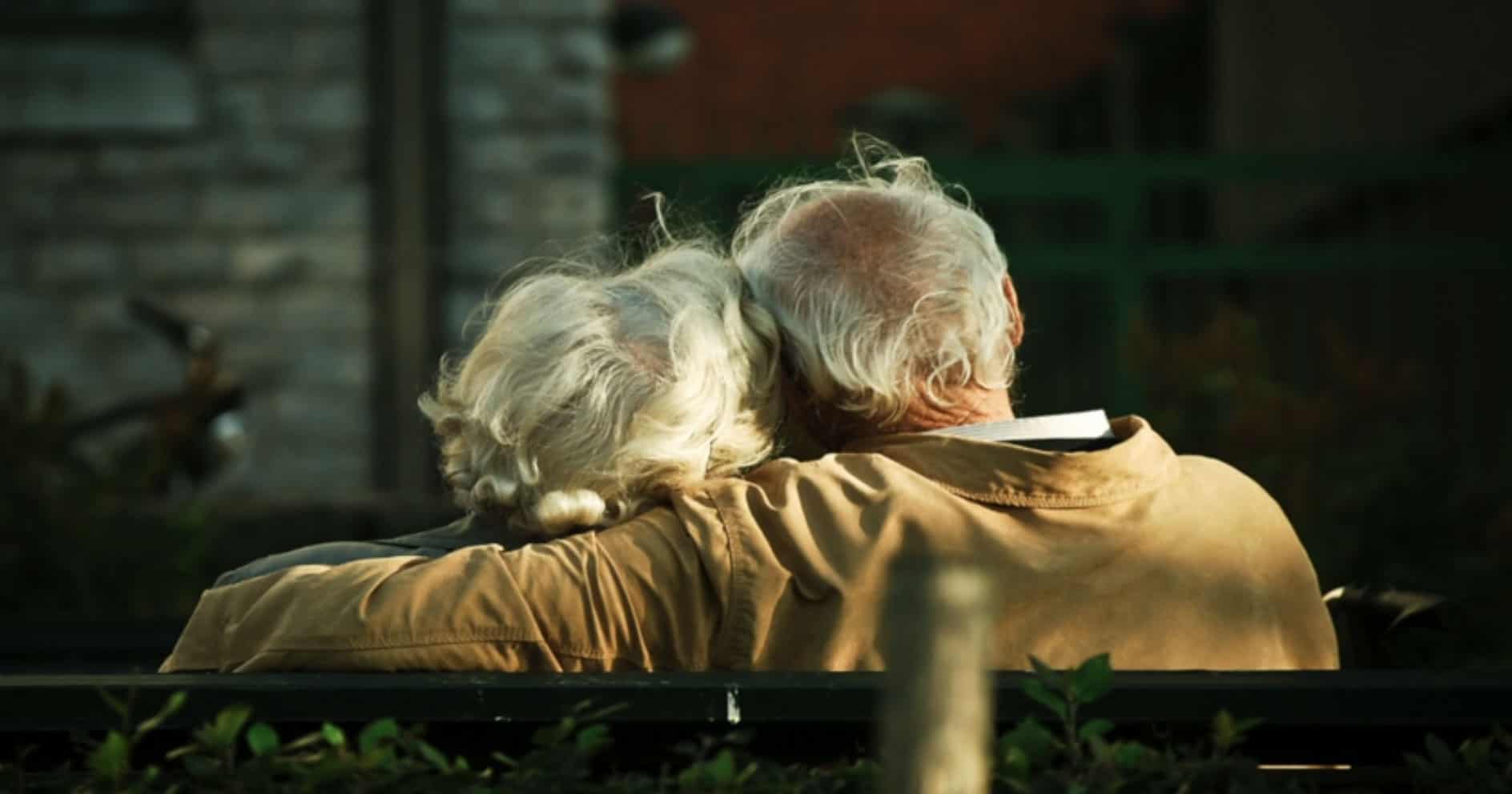 mature couple, from behind, embracing