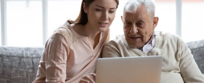 Younger woman helps older man answer the question, what is cremation insurance