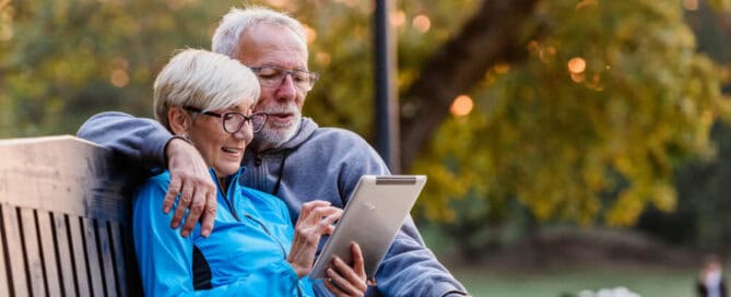 Couple uses tablet to create a cremation plan.