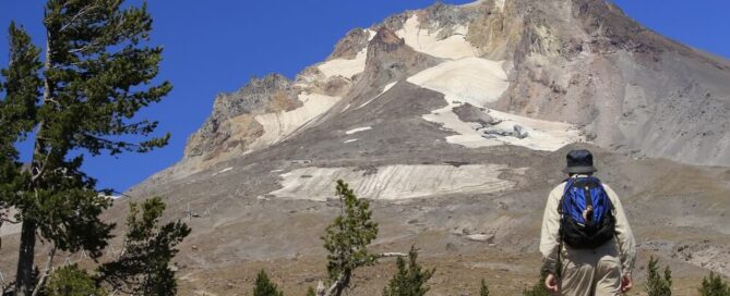 Man walking near Mount Hood - green cremation Oregon.