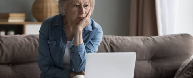 older woman considers costs to return a loved one home.