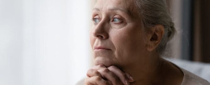 older woman mourns the death of a loved one