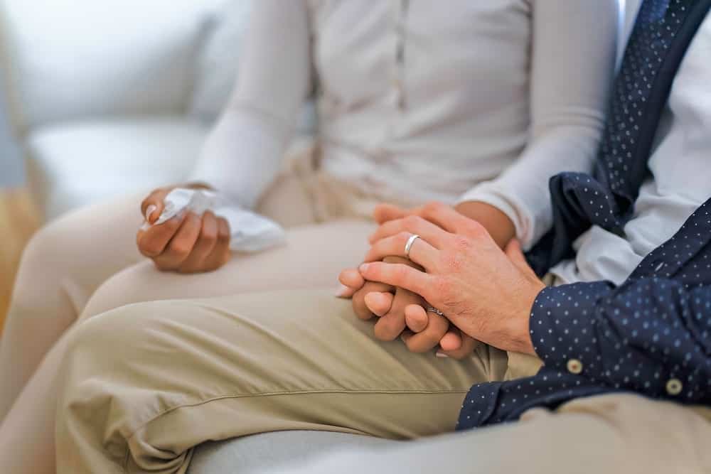 Two people comfort each other and show sincere appreciation